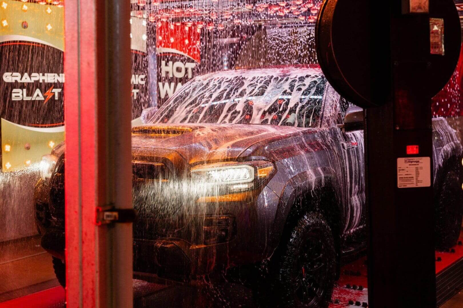 A truck being washed in the tunnel