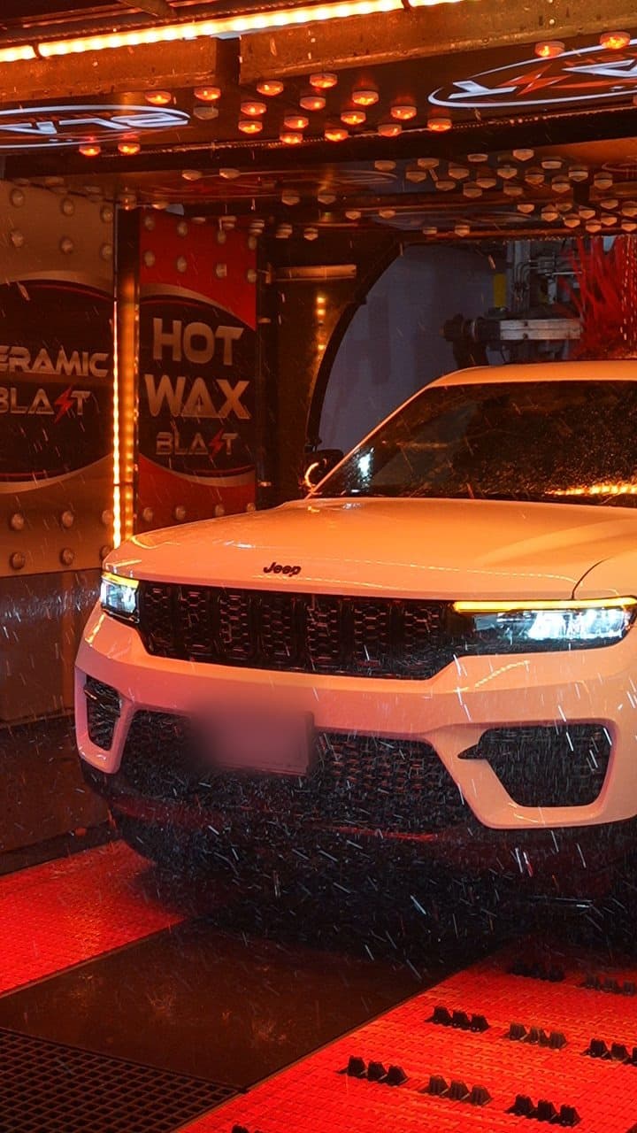 A Jeep inside the Blast wash tunnel beneath the Ceramic Blast and Hot Wax arches